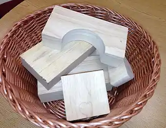 Block Puzzle Activity Various size wood Blocks in Wicker Basket
