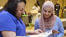 Becker’s Sales Specialist showing catalog and sharing product expertise