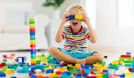 Child playing with building blocks